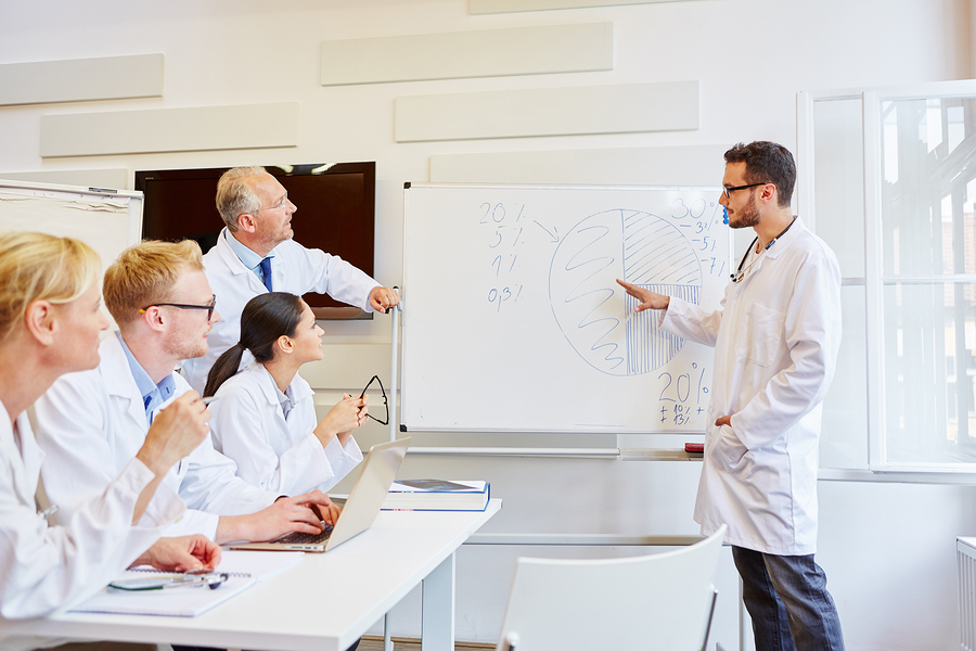 Doctor as instructor presenting and training during seminar