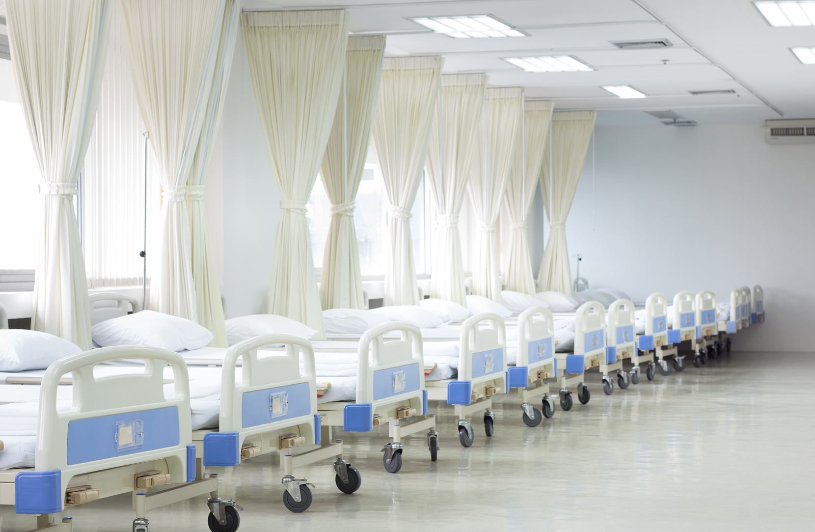 Hospital ward with beds and medical equipment interior of new empty hospital room.