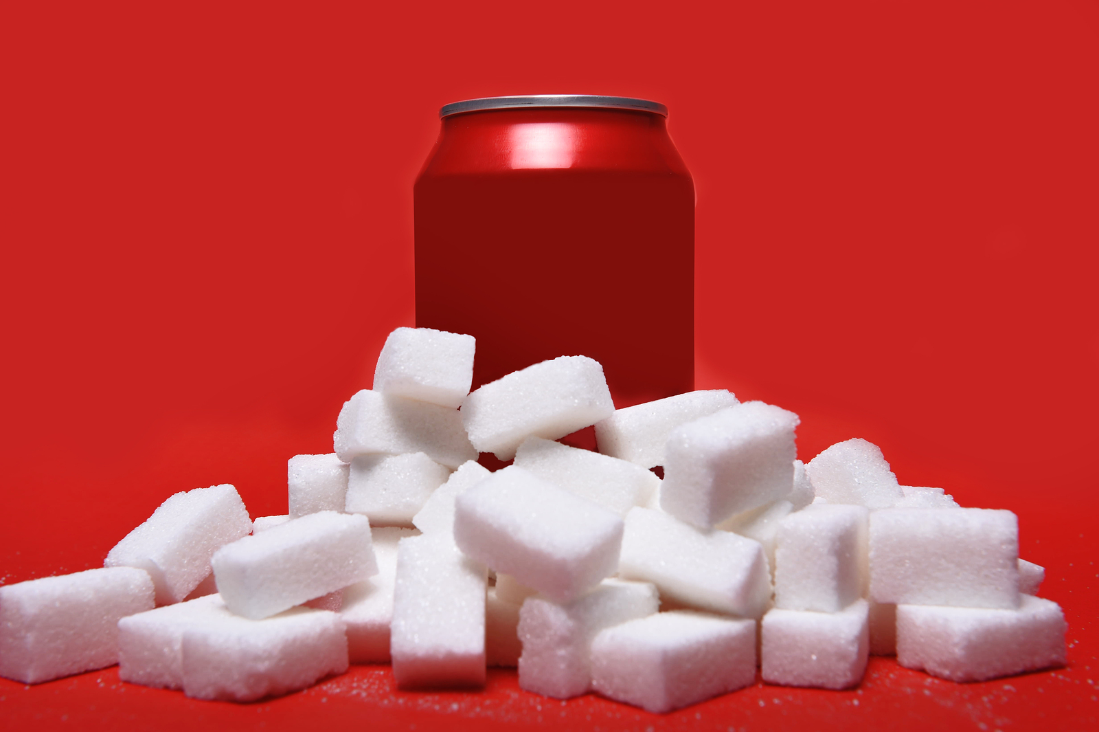 white sugar cubes representing the big amount of calories content in the soda in unhealthy nutrition