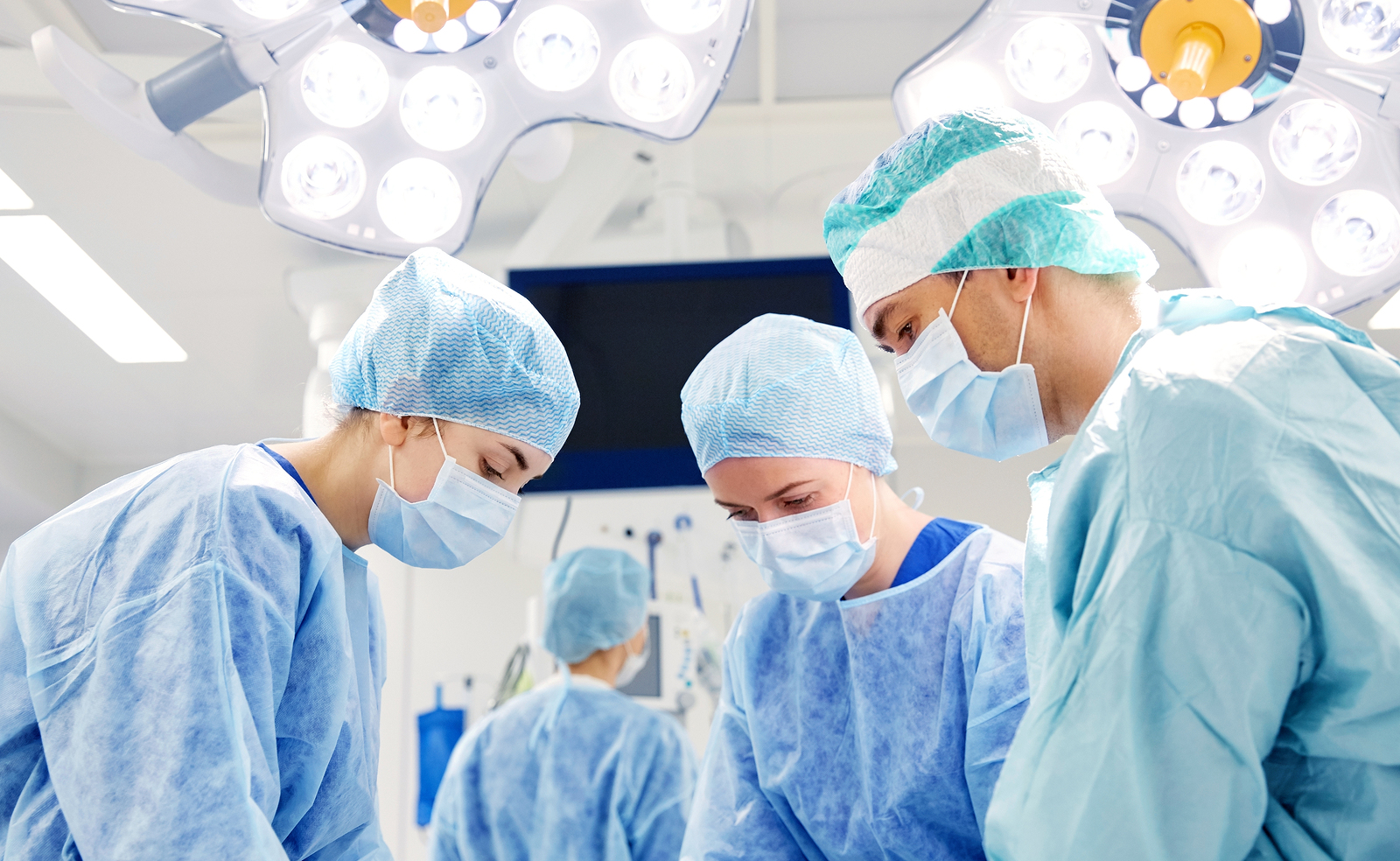 group of surgeons at operation in theatre room at hospital